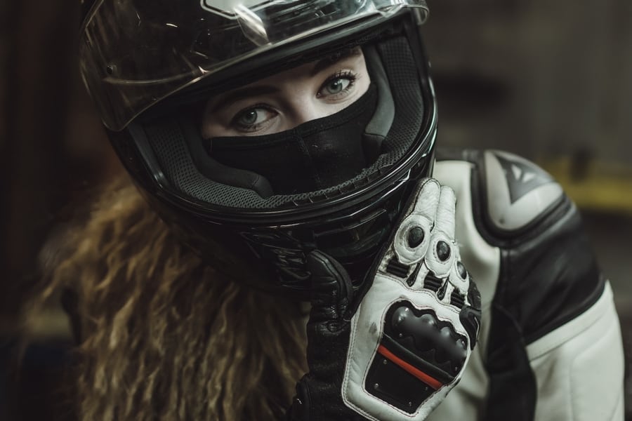 woman with motorcycle face mask and helmet